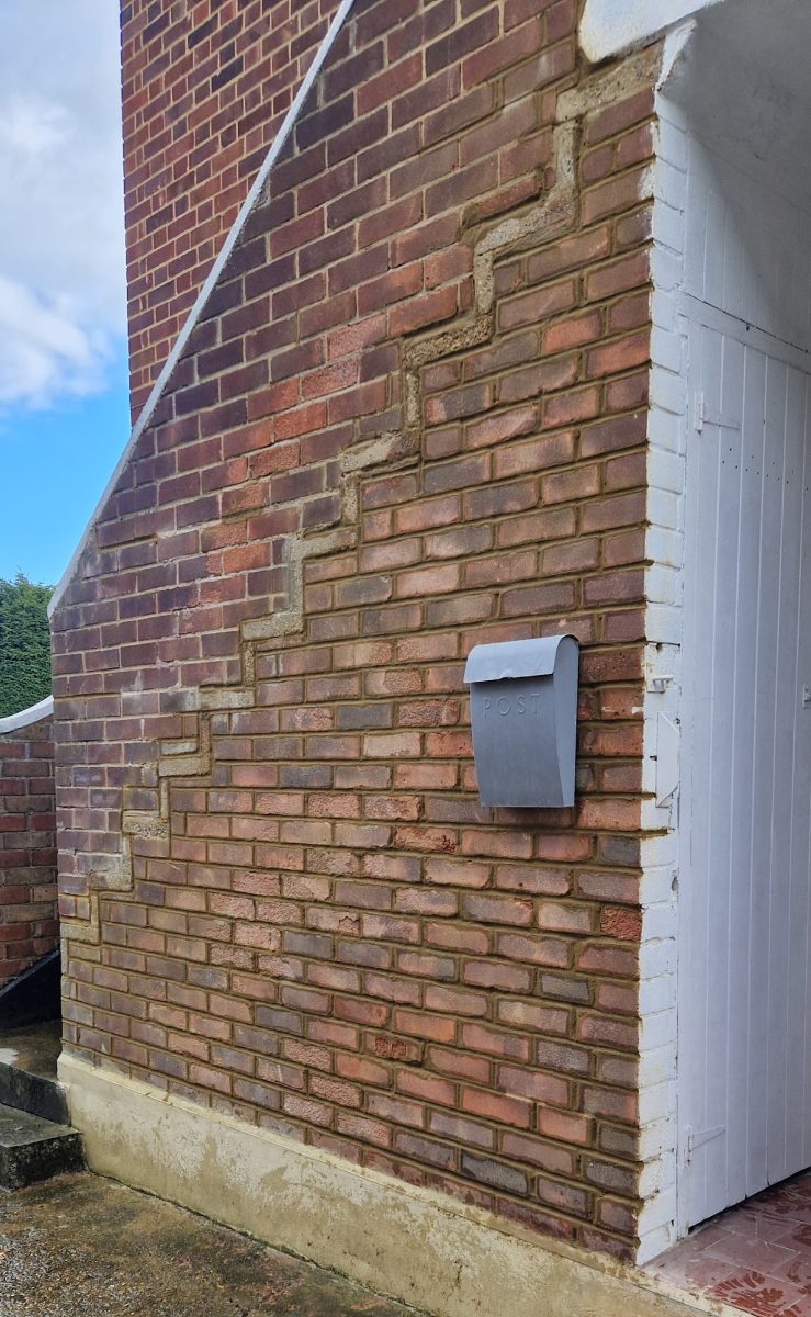 Gable side wall rebuilt and toothed into the existing brickwork